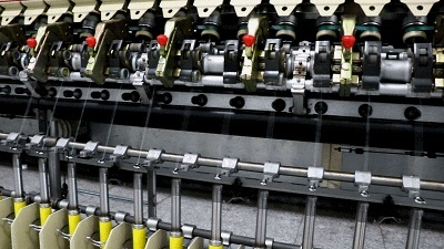 The Art of Textile Manufacturing:A Review of the纺织厂针梳机的精湛工艺